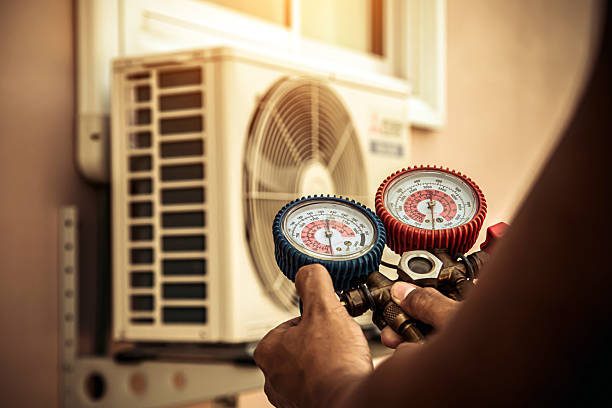 Professional Air Conditioning Service technician working in Marion, IN